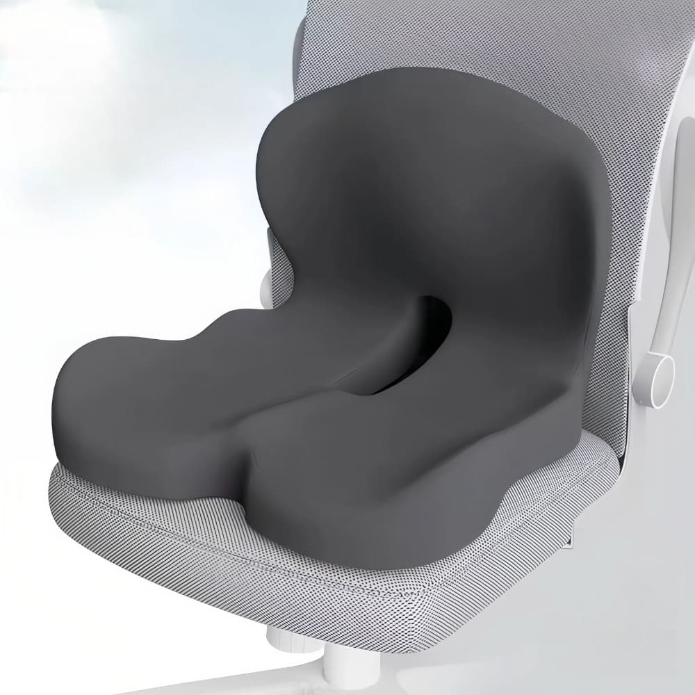 Gray memory foam seat cushion on an office chair with a light gray background