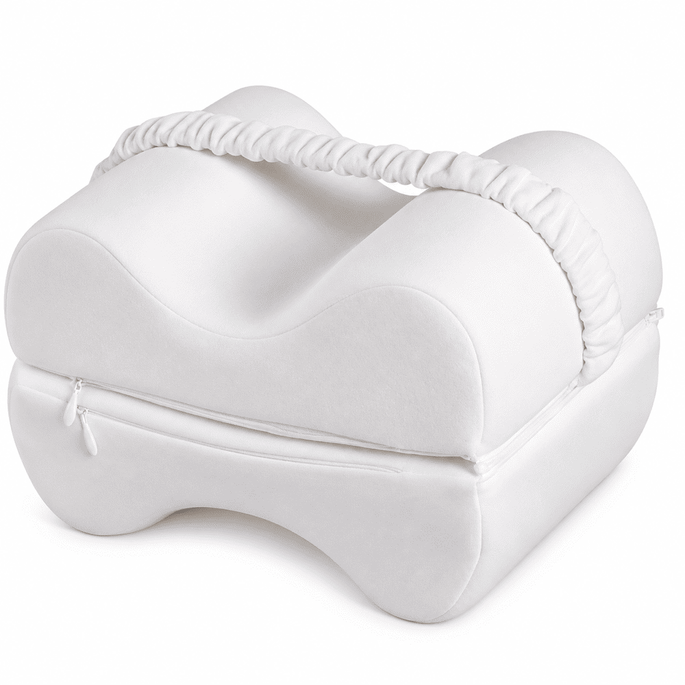 A white contoured baby support pillow with a zippered bottom and a gathered elastic carrying handle, shown on a clean white background.