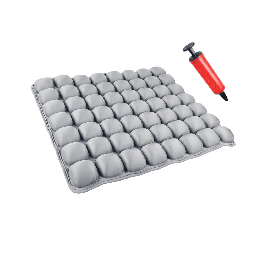 Gray inflatable cushion with a red and black pump on a white background