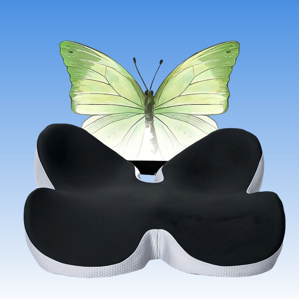 Black and white butterfly-shaped pillow with a green butterfly on a blue gradient background