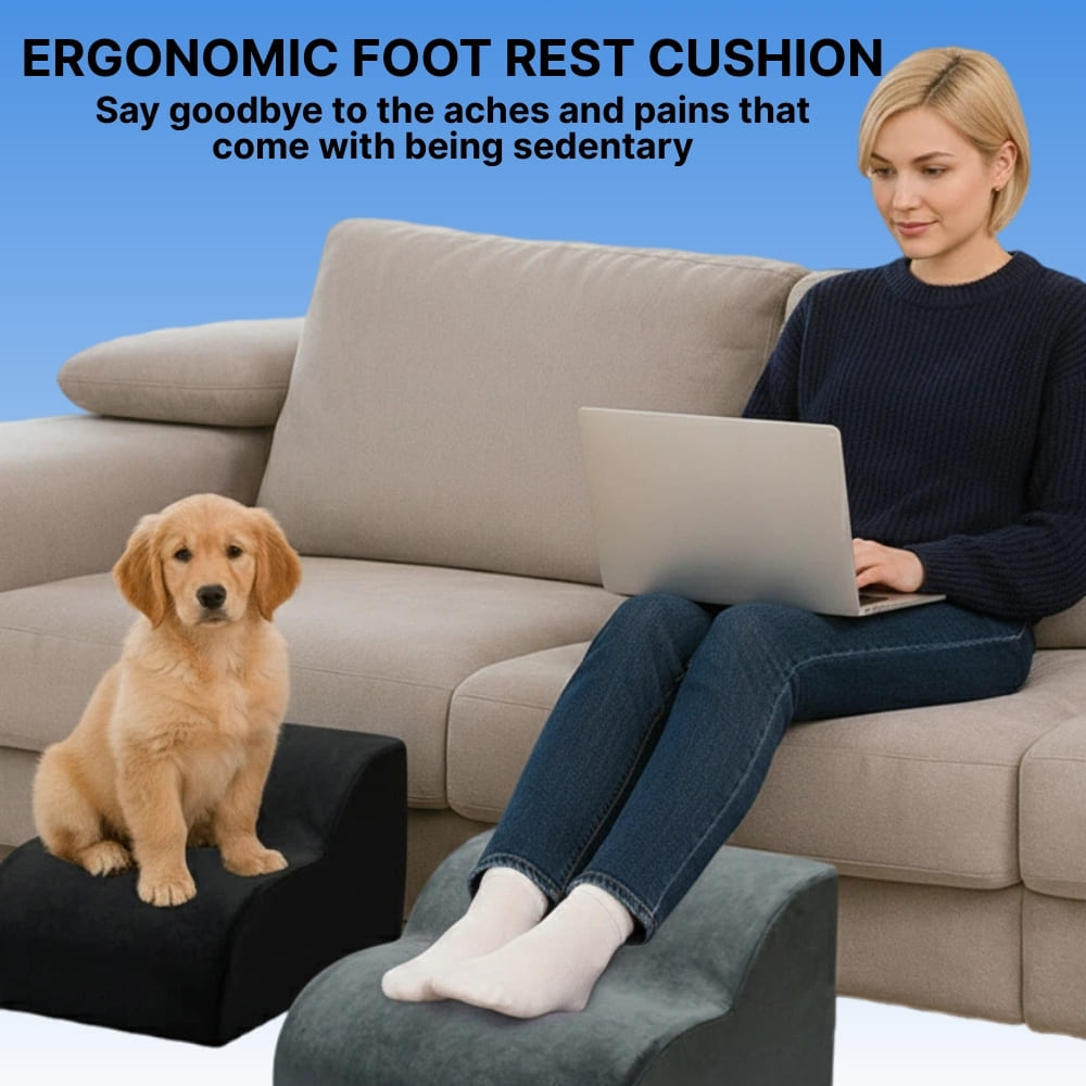 Woman using a laptop on a couch with a dog on a footrest, promoting an ergonomic foot rest cushion.