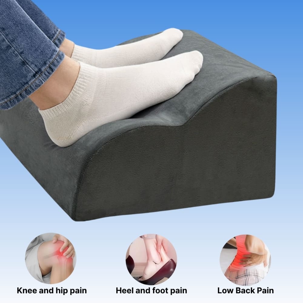 Person using a gray footrest with pain relief icons at the bottom.