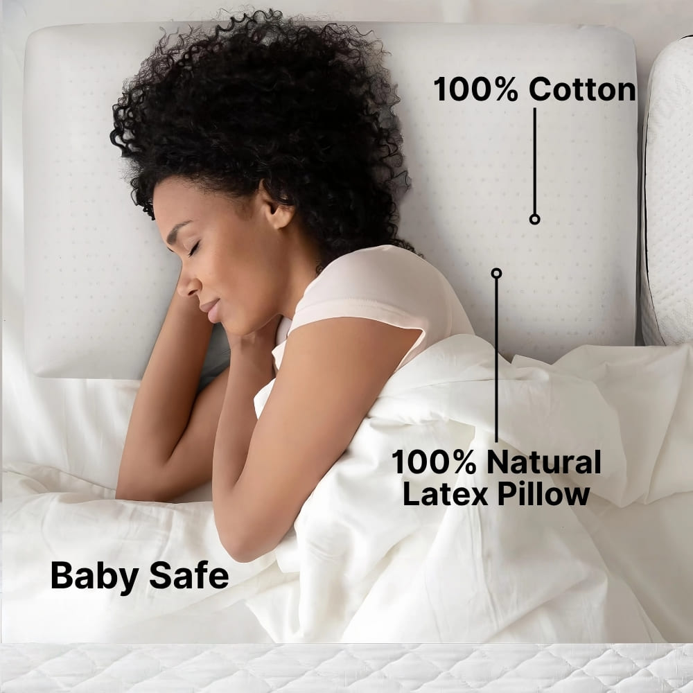 Woman sleeping on a bed with a 100% natural latex pillow labeled as baby safe.