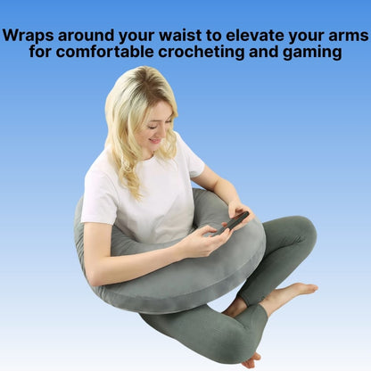 Woman using a waist support pillow for comfortable crocheting and gaming on a blue background