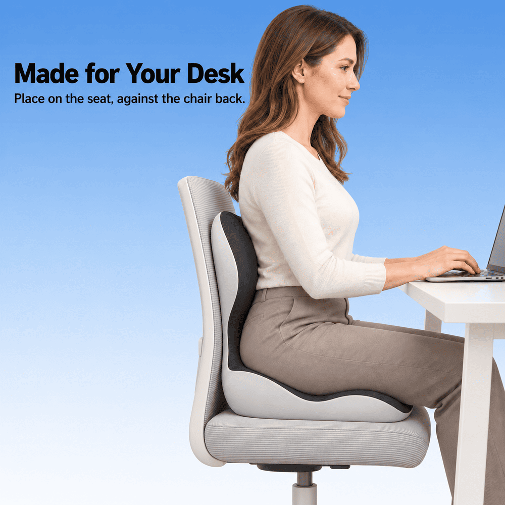 Woman using a black and light gray seat and back cushion on an office chair while working at a desk