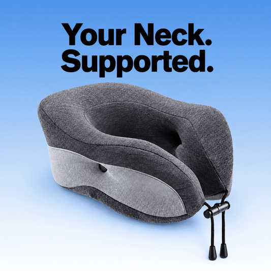 Charcoal and light gray travel neck pillow with raised sides, an open center and a front drawcord on a blue background
