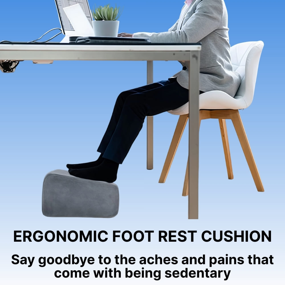 Person sitting at a desk with an ergonomic foot rest cushion, promoting relief from sedentary work.