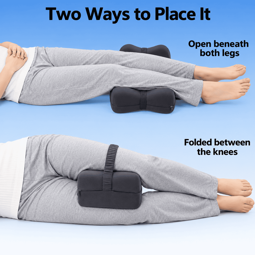 Black foldable knee support pillow shown open beneath both legs and folded between the knee