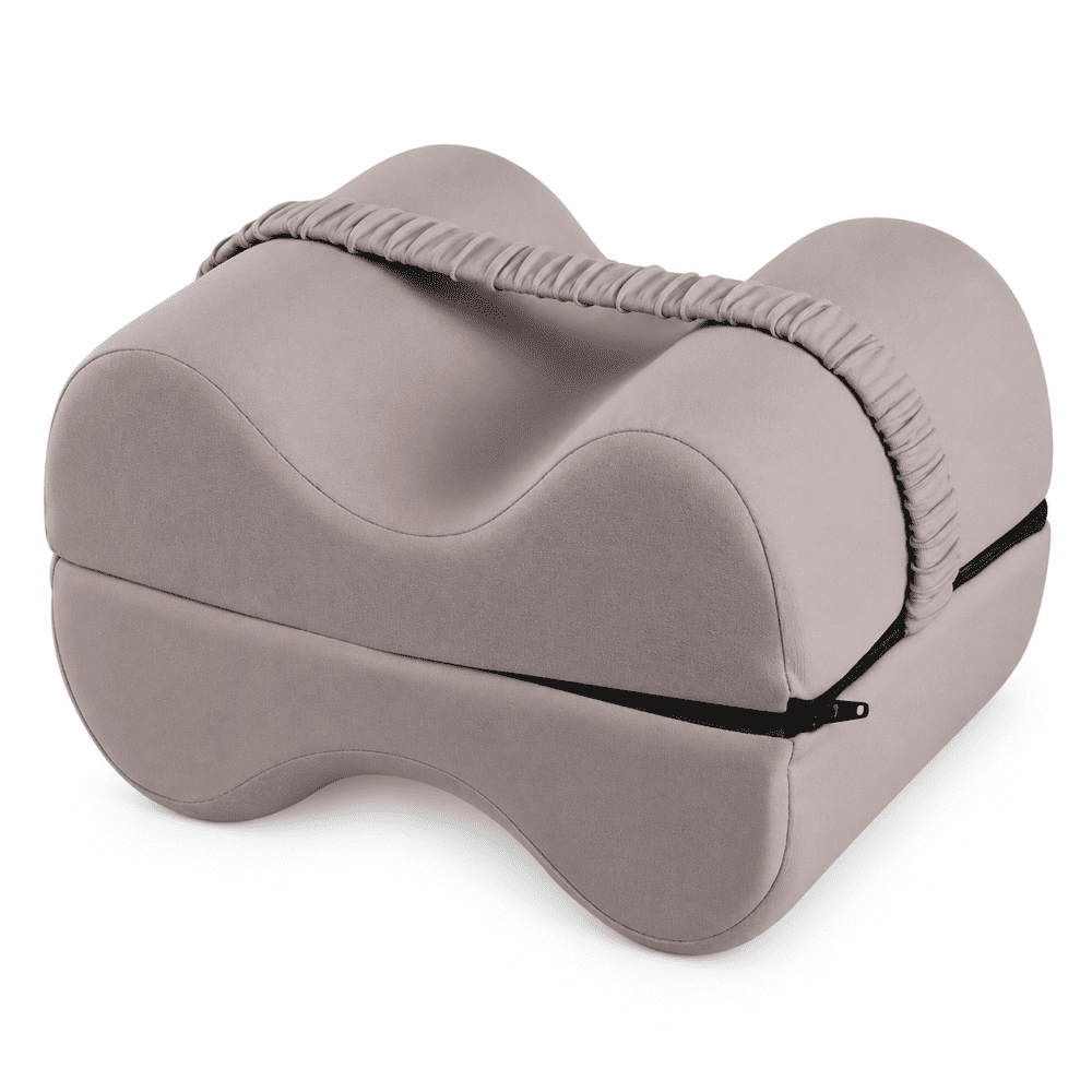 A contoured memory foam pillow in a muted taupe-gray color, featuring a matching fabric neck support strap and a black zipper closure, shown on a solid white background.