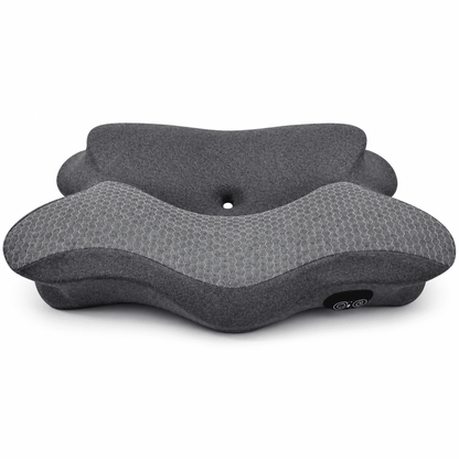 A dark gray contoured neck pillow with a textured honeycomb pattern on the top surface and a smooth fabric side, shown on a plain white background.