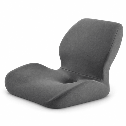A modern gray molded chair with a curved backrest and a central circular cutout, shown on a plain white background.