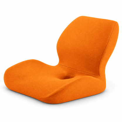 An orange fabric floor chair with a curved, ergonomic design and a central cup-holder cutout, shown on a clean white background.