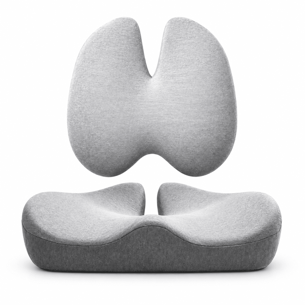 A light gray ergonomic split-seat cushion shown in two views: a floating upper half and a lower contoured seat base, on a clean white background.
