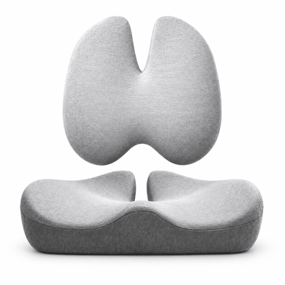 A light gray ergonomic split-seat cushion shown in two views: a floating upper half and a lower contoured seat base, on a clean white background.