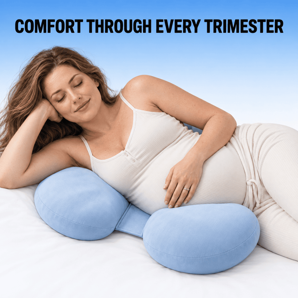 A pregnant woman reclines on a white bed using a light blue U-shaped maternity pillow, with the text 'COMFORT THROUGH EVERY TRIMESTER' at the top against a blue gradient background.